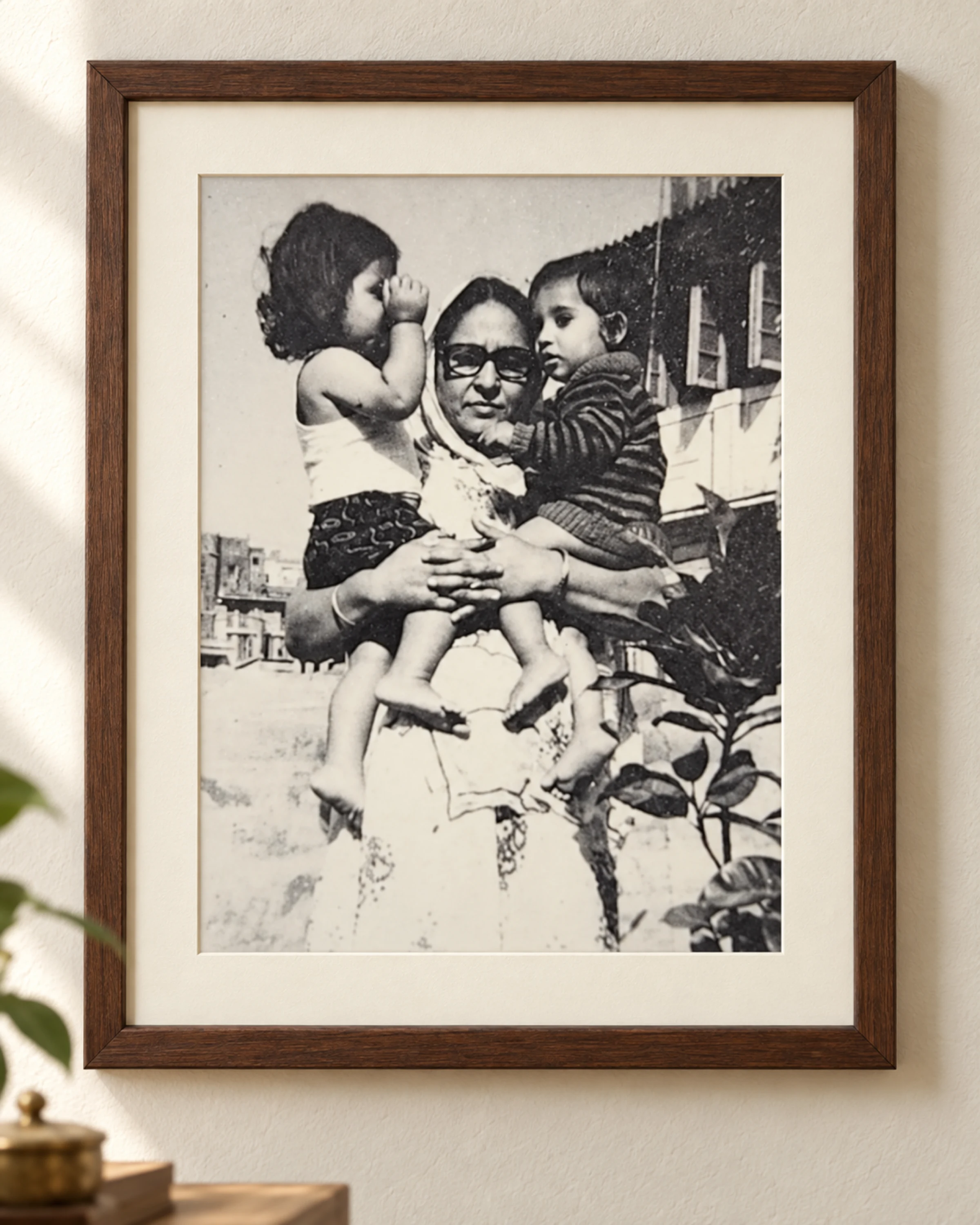 A framed family photograph of Savitri Devi Sharma
